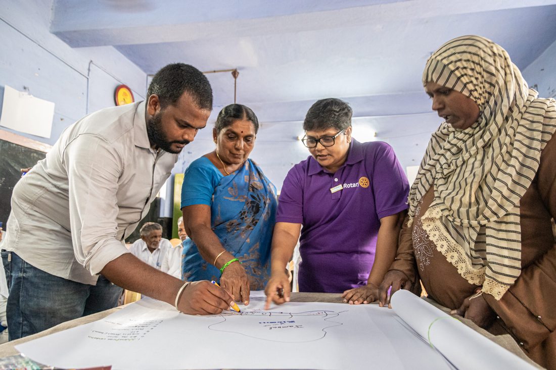 Students and teachers working together at school