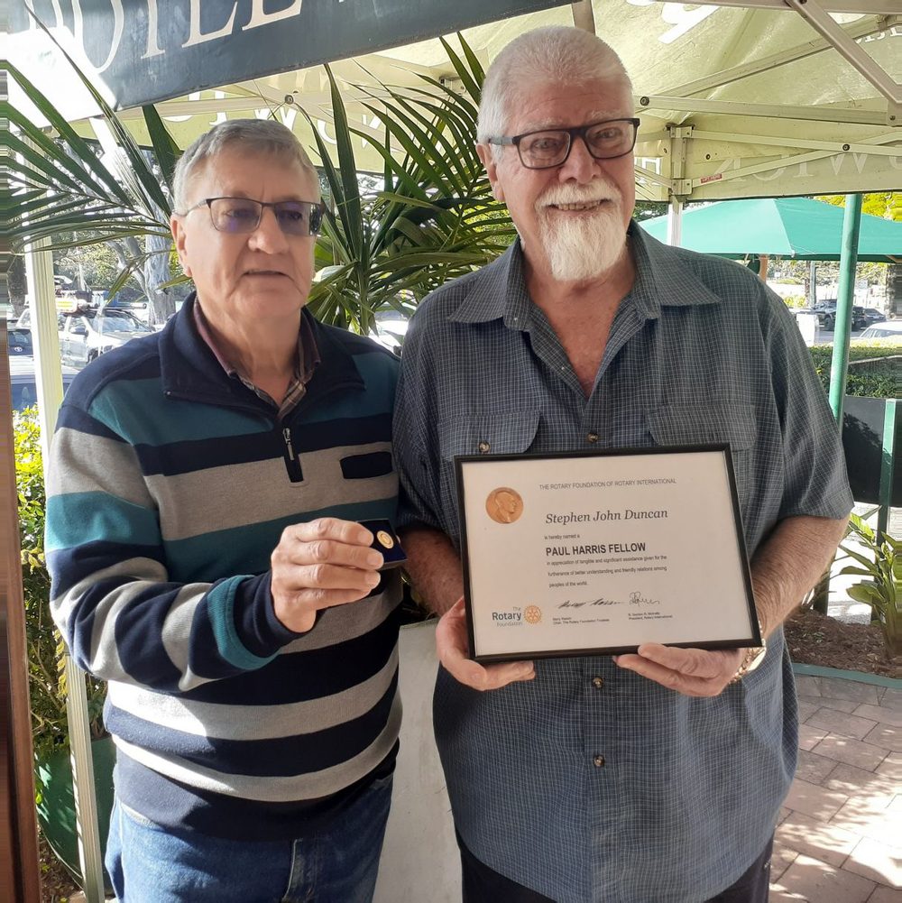 A club member receiving a Paul Harris Fellow certificate