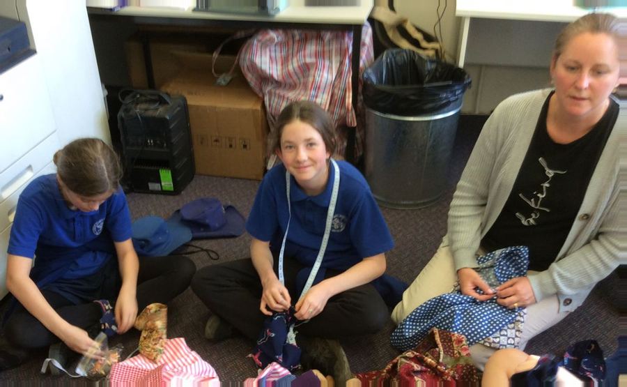 Volunteers sorting donated goods for young people in need